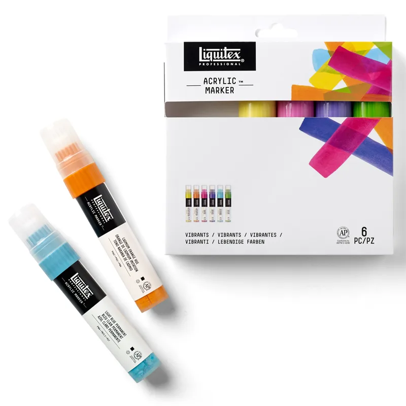 Komplet mazaków akrylowych Liquitex Acrylic Marker Vibrants Wide 8-15 mm na białym tle, z leżącymi obok dwoma markerami z zestawu.